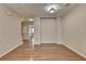 Open concept living room area with hardwood floors and neutral walls at 702 Village Field Ct, Suwanee, GA 30024