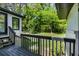 Relaxing view from a deck with black railings, overlooking a lush backyard perfect for outdoor activities at 888 Old Tucker Rd, Stone Mountain, GA 30087