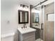 Modern bathroom with a glass shower, sleek vanity, and stylish mirror creating a spa-like retreat at 888 Old Tucker Rd, Stone Mountain, GA 30087