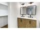 Stylish bathroom with a dual sink vanity, modern fixtures, and ample lighting for a luxurious feel at 888 Old Tucker Rd, Stone Mountain, GA 30087