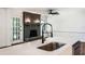 Modern kitchen with quartz countertops, stainless steel appliances, and an elegant sink faucet at 888 Old Tucker Rd, Stone Mountain, GA 30087