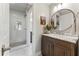 Bright bathroom with a marble countertop vanity and glass-enclosed shower at 1050 Signal Pointe, Alpharetta, GA 30005