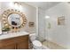 Chic bathroom with a decorative mirror, modern vanity, and glass shower at 1050 Signal Pointe, Alpharetta, GA 30005