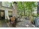 Wooden deck with outdoor furniture, grill, and surrounded by a lush, green landscape at 1050 Signal Pointe, Alpharetta, GA 30005