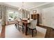 Bright dining room featuring a wooden table, elegant chairs, and a modern chandelier at 1050 Signal Pointe, Alpharetta, GA 30005