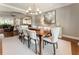 Elegant dining room featuring a large table, chandelier, and refined decor at 1050 Signal Pointe, Alpharetta, GA 30005
