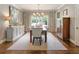 Inviting dining room with a large table, neutral rug, and scenic views through the window at 1050 Signal Pointe, Alpharetta, GA 30005