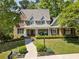 Charming two-story home with a beautifully landscaped front yard and a welcoming entrance at 1050 Signal Pointe, Alpharetta, GA 30005