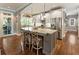 Spacious kitchen island features seating and stone countertops at 1050 Signal Pointe, Alpharetta, GA 30005