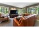 Comfortable living room featuring a large sectional sofa and a wall-mounted television at 1050 Signal Pointe, Alpharetta, GA 30005