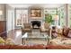 Cozy living room features a fireplace and ample natural light at 1050 Signal Pointe, Alpharetta, GA 30005