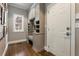 Mudroom with custom built-in storage, bench seating and natural light at 1050 Signal Pointe, Alpharetta, GA 30005