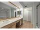 Bathroom featuring double sinks, tile floors and shower, and built-in storage at 3777 Peachtree Ne Rd # 1536, Atlanta, GA 30319