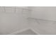 Walk-in closet with upper shelving for optimal storage and organization at 3777 Peachtree Ne Rd # 1536, Atlanta, GA 30319