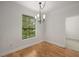 Bright dining room features hardwood floors, natural light, and modern chandelier at 3777 Peachtree Ne Rd # 1536, Atlanta, GA 30319