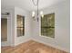 Light-filled dining room featuring hardwood floors, modern lighting and large windows at 3777 Peachtree Ne Rd # 1536, Atlanta, GA 30319