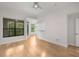Spacious living area featuring hardwood floors, a wall of windows, and natural light at 3777 Peachtree Ne Rd # 1536, Atlanta, GA 30319