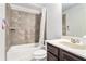 Bathroom featuring a tub, shower, toilet, vanity with sink, and tile accents at 3780 Casual Ridge Way, Loganville, GA 30052