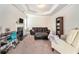Bedroom offering a comfortable sofa, a work desk, and a cozy fireplace with decorative molding at 3780 Casual Ridge Way, Loganville, GA 30052