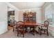 Elegant dining room featuring a classic china cabinet and chandelier, perfect for gatherings at 3780 Casual Ridge Way, Loganville, GA 30052