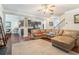 Spacious living area showcasing hardwood floors and a seamless transition to the kitchen at 3780 Casual Ridge Way, Loganville, GA 30052