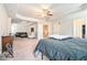 Spacious main bedroom with sitting area, tray ceilings, and doorways leading to other areas of the house at 3780 Casual Ridge Way, Loganville, GA 30052