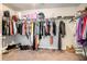 Spacious walk-in closet with organized clothing racks, shelving, and carpet flooring at 3780 Casual Ridge Way, Loganville, GA 30052