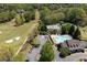Aerial view showing the golf course, swimming pool and tennis courts near the clubhouse at 402 Glenhurst Trce, Canton, GA 30115