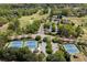 High aerial view of the tennis courts, golf course and clubhouse at 402 Glenhurst Trce, Canton, GA 30115