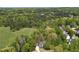 Aerial view of a beautiful home surrounded by lush greenery and trees at 402 Glenhurst Trce, Canton, GA 30115