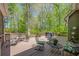 Outdoor deck with seating and grill, perfect for backyard gatherings and enjoying nature at 402 Glenhurst Trce, Canton, GA 30115