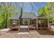 Backyard of home with wooden deck, screened in porch and backyard view at 402 Glenhurst Trce, Canton, GA 30115