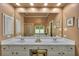 A full view of the double sink vanity with white cabinetry, recessed lighting, and full length mirrors in the bathroom at 402 Glenhurst Trce, Canton, GA 30115