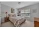 Cozy bedroom with natural light, a comfortable bed, and side tables for a relaxing atmosphere at 402 Glenhurst Trce, Canton, GA 30115