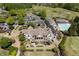 Aerial shot of the community clubhouse, highlighting the swimming pool and ample parking, perfect for social gatherings at 402 Glenhurst Trce, Canton, GA 30115