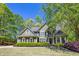 Charming two-story home with lush landscaping, a well-maintained lawn, and classic architectural details at 402 Glenhurst Trce, Canton, GA 30115