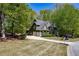 Charming two-story home with lush landscaping, a well-maintained lawn, and classic architectural details at 402 Glenhurst Trce, Canton, GA 30115