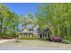 Charming two-story home with lush landscaping, a well-maintained lawn, and classic architectural details at 402 Glenhurst Trce, Canton, GA 30115