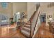 Grand foyer with hardwood floors, staircase, and ample natural light creates a welcoming entrance at 402 Glenhurst Trce, Canton, GA 30115