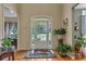 Inviting foyer with hardwood floors, a glass-paneled door, and views into the adjacent living spaces at 402 Glenhurst Trce, Canton, GA 30115