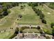 Scenic aerial view of a lush golf course with manicured greens and mature trees, perfect for golfers of all skill levels at 402 Glenhurst Trce, Canton, GA 30115