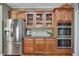 Kitchen showcases stainless steel refrigerator, double ovens, and ample cabinet space at 402 Glenhurst Trce, Canton, GA 30115
