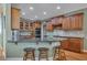 Kitchen features wood cabinets, granite countertops, stainless steel appliances, and a breakfast bar at 402 Glenhurst Trce, Canton, GA 30115
