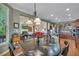Open kitchen showcasing stainless steel appliances, granite countertops, and a seamless flow to living area at 402 Glenhurst Trce, Canton, GA 30115