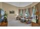 Cozy living room with plush seating, large windows offering natural light, and elegant decor at 402 Glenhurst Trce, Canton, GA 30115