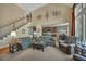 Open-concept living area with high ceilings, staircase, and seamless transition to the kitchen area at 402 Glenhurst Trce, Canton, GA 30115