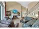 Cozy living room featuring a fireplace, built-in shelving, and comfortable seating for relaxation and entertainment at 402 Glenhurst Trce, Canton, GA 30115