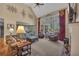 Spacious living room featuring vaulted ceilings, large windows, and comfortable seating areas for relaxation at 402 Glenhurst Trce, Canton, GA 30115