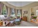 Cozy living room with plush seating, large windows offering natural light, and elegant decor at 402 Glenhurst Trce, Canton, GA 30115