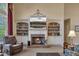Elegant living room with fireplace, built-in cabinets and shelving for storage at 402 Glenhurst Trce, Canton, GA 30115